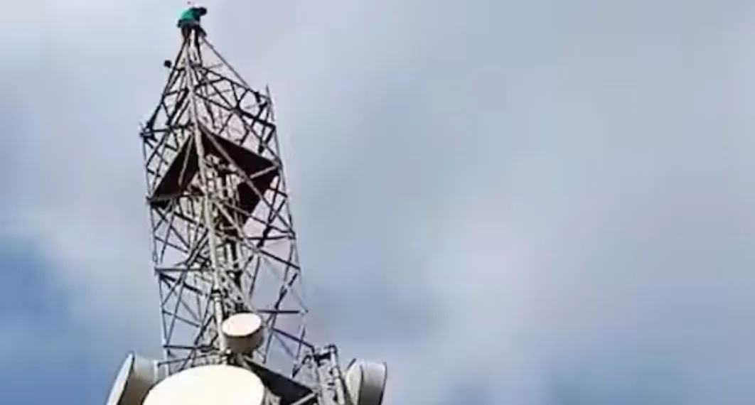 Youth demands Maratha reservation by climbing mobile tower in jamkhed Ahmednagar