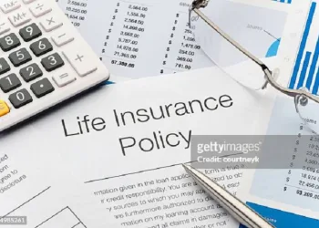 Close up of Life Insurance Policy with pen, calculator