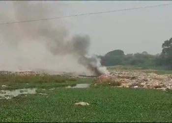 Garbage caught with fire mula mutha river bank in loni kalbhor pune